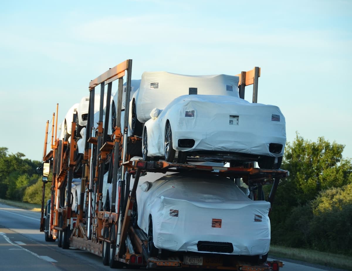 New Corvettes loaded on an American car hauler for transport